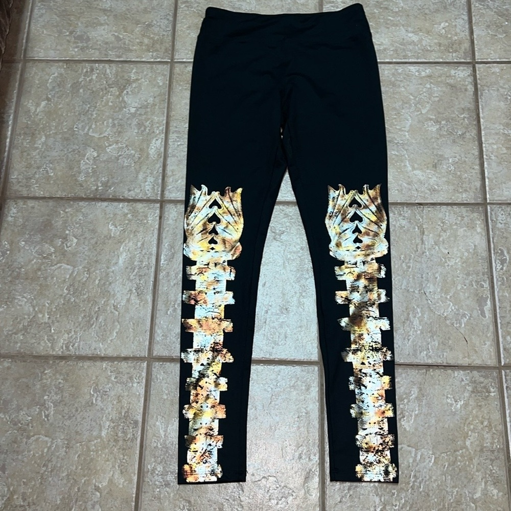 Nuelle by Nuyu black and gold Wonder Woman leggings